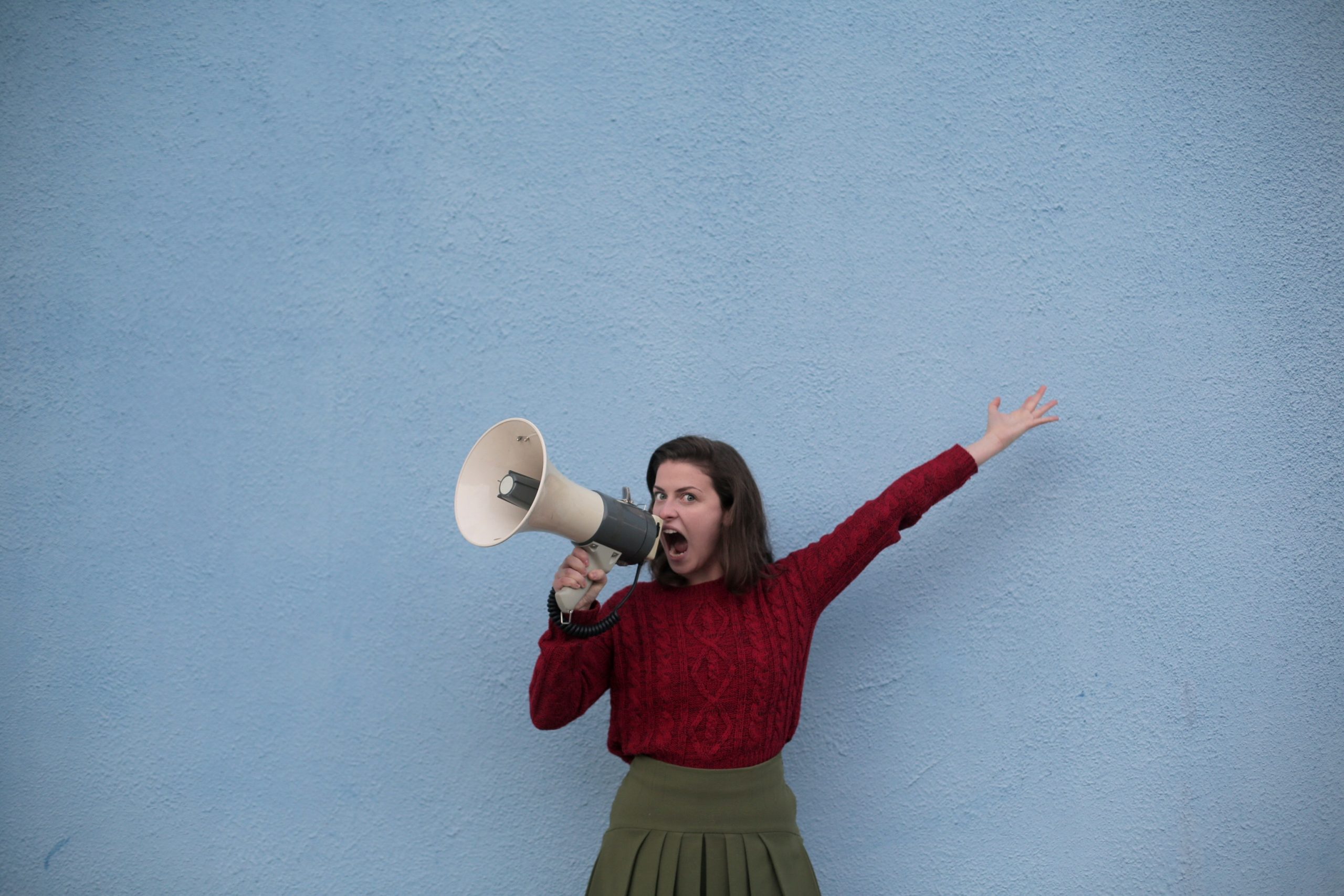 A woman yelling in a megaphone