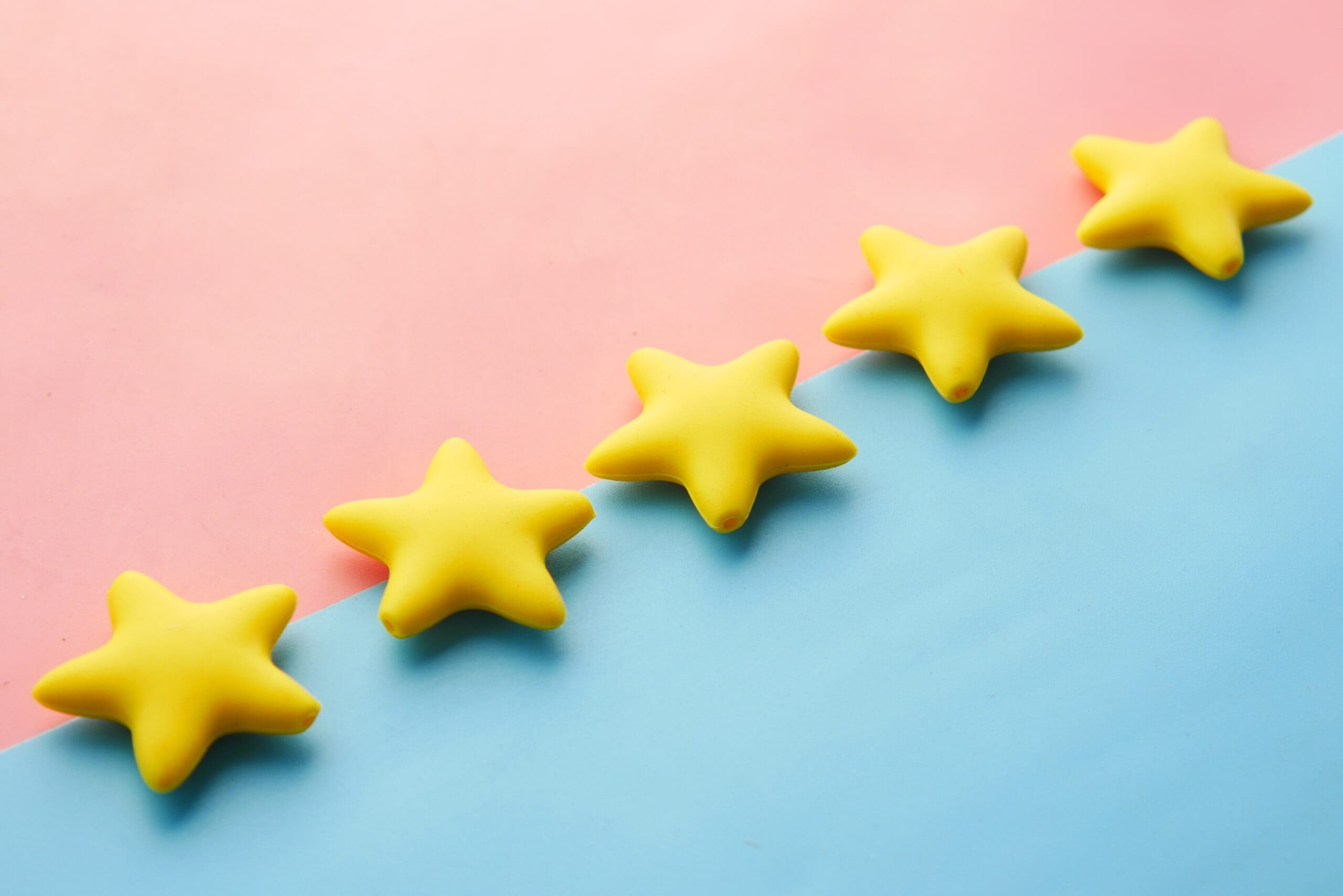 five 3d stars on a blue & pink background